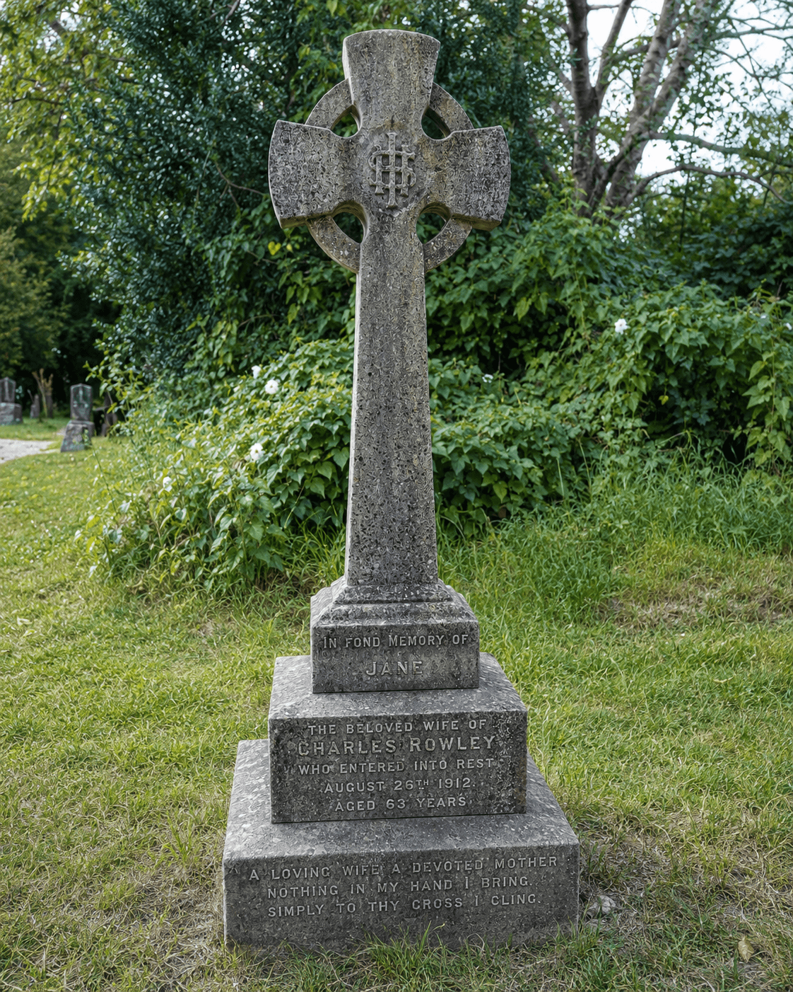 Grave marker for Jane Shepard Rowley, a tall Celtic cross inscribed "A loving wife, a devoted mother"