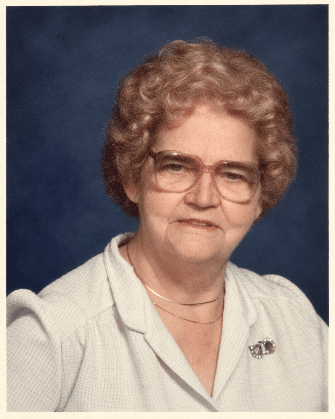 Violet in her late 60s or early 70s